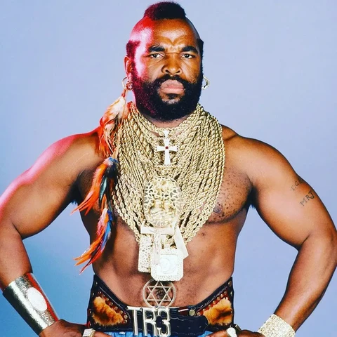 Mr T topless wearing dozens of gold neck chains.