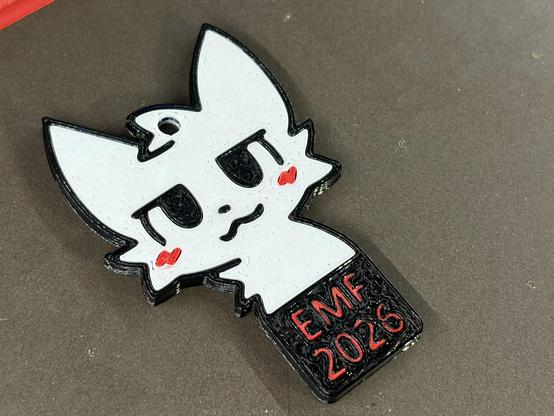 3d printed boykisser with EMF 2026 written below