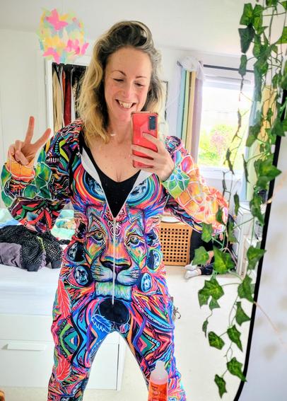 Me in an incredible psychedelic onesie. It features a lion's face. Or does it??! Maybe you're just trippin. Husband hidden (on his request from sheer embarrassment in background.